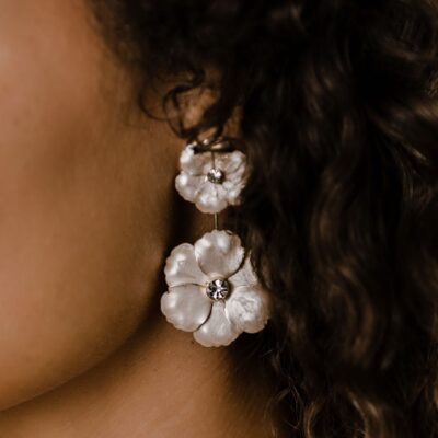 Flower drop earrings on model