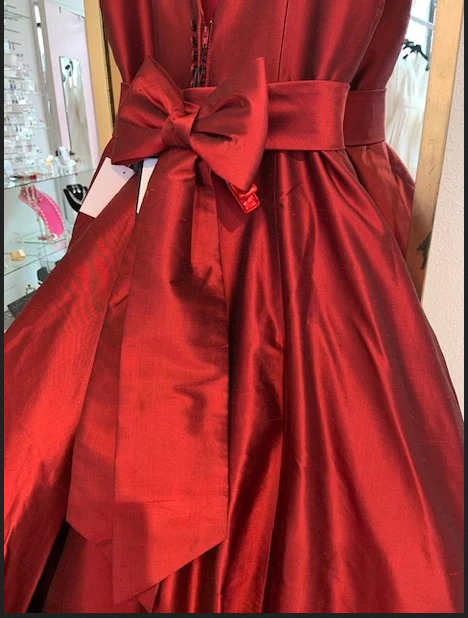 Back of Justin Alexander red ball gown